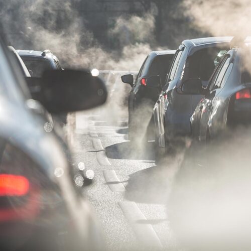 car exhaust clouds in traffic